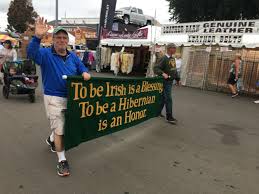 Salute to Holyoke Day parade at the Big E with marching band and colorful floats