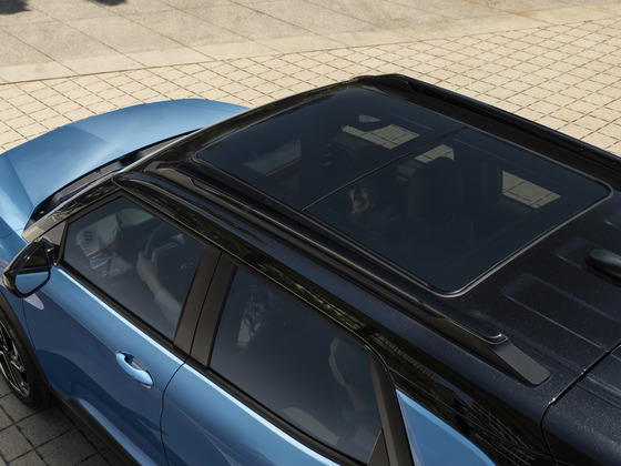 2025 Chevy Trailblazer Panoramic Sunroof The available panoramic sunroof on the 2025 Chevrolet Trailblazer, open to a bright blue sky, filling the interior with natural light